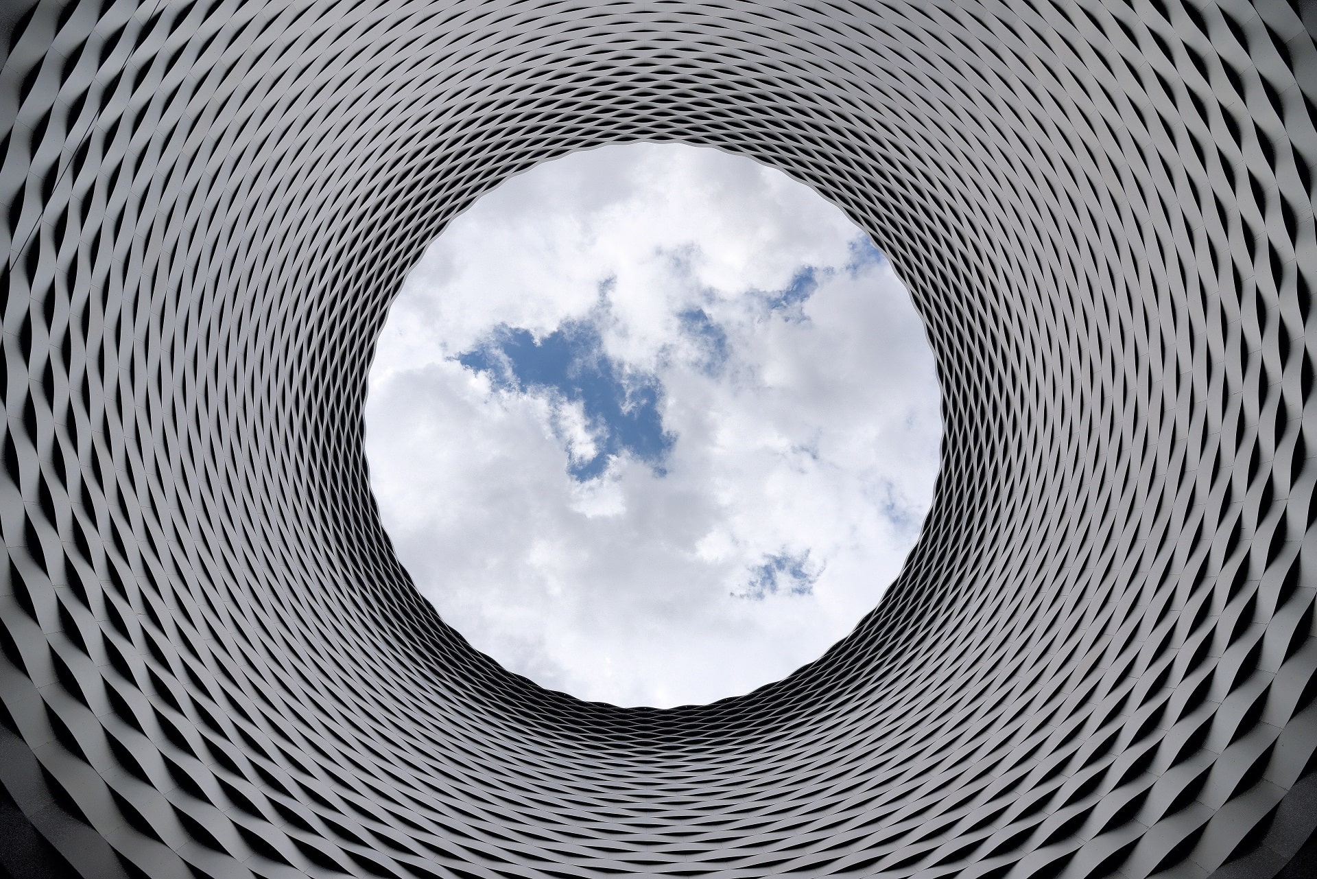 Cloud Services in San Jose, CA--represented by a view of clouds through a cylindrical sculpture.